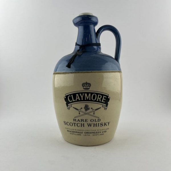 Cuatro botellas de whisky en gres