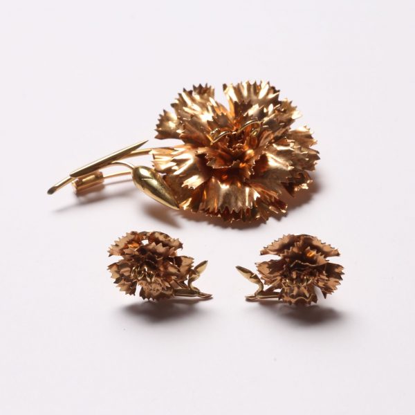 Prendedor y caravanas oro 18 K