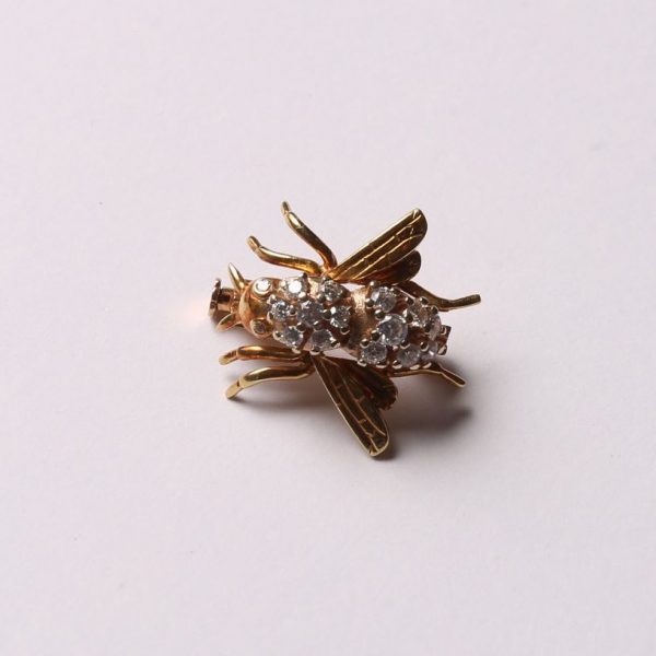 Prendedor oro 18 K y circonias