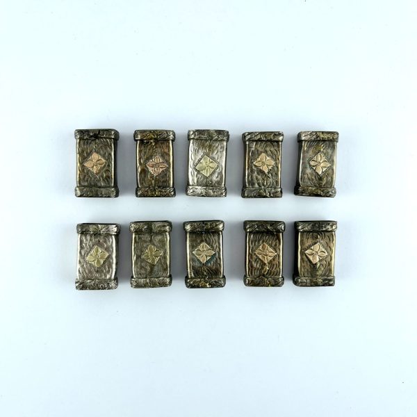 Conjunto de diez pasadores en plata y oro