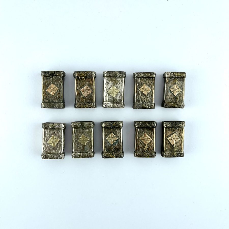 Conjunto de diez pasadores en plata y oro
