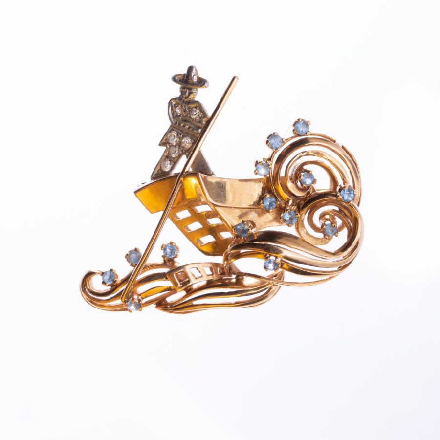 Prendedor oro 18 K amarillo y blanco, diamantes y topacios